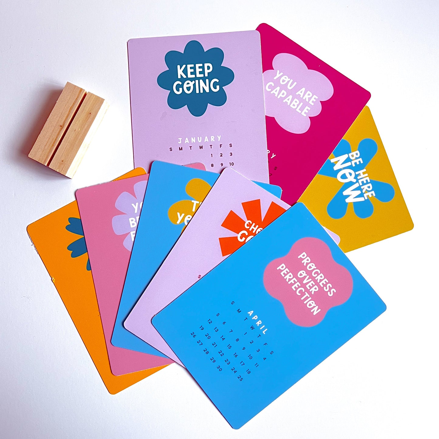 Set of colorful motivational desk calendar cards on a white background